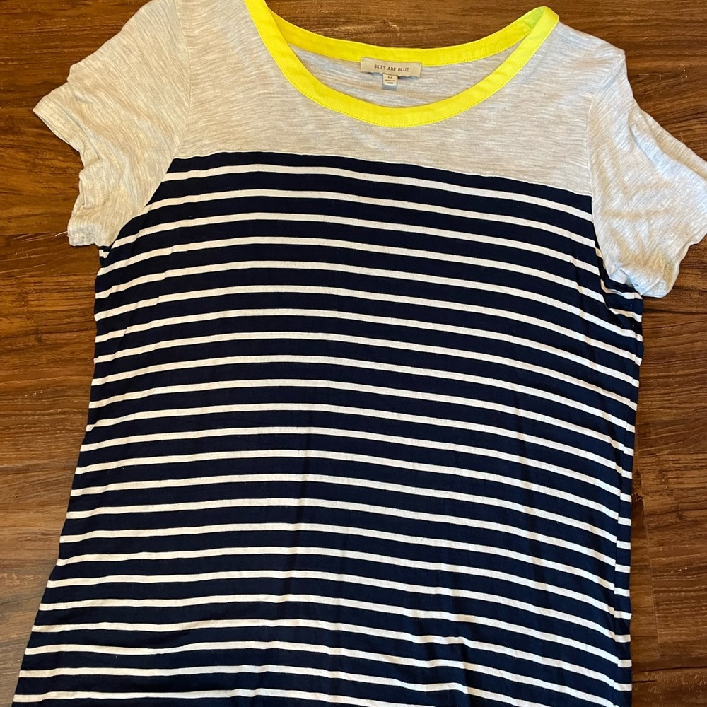 Skies are blue t-shirt, navy stripe detail on lower portion